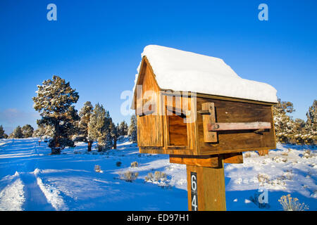 A rural wooden mail box and newspaper box along a country road in central Oregon
