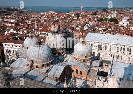 Domes of Basilica di San Marco St Marks and part of Doges Palace seen from top of St Marks Bell Tower Venice Italy DOMES BASILIC Stock Photo