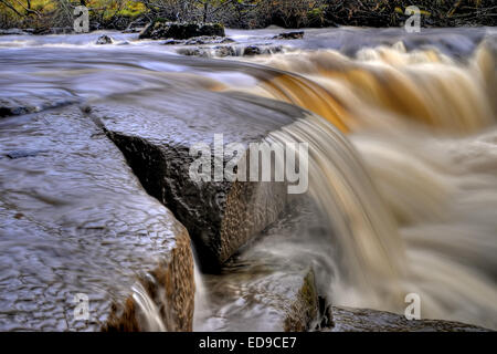 500 yards downstream from Wainwath Force on the River Swale some 1 mile from keld are a series of small waterfalls. Stock Photo