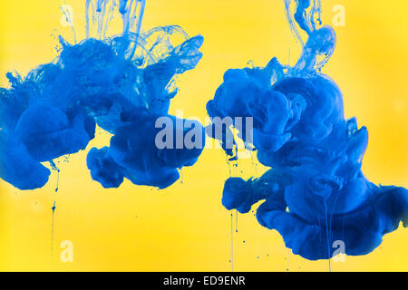 Ink In Water Project - Blue and Yellow Stock Photo