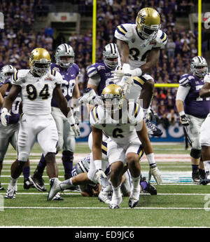 San Antonio, Texas, USA. 02nd Jan, 2015. Bruins linebacker Eric Kendricks (6) celebrates his first half sack with UCLA Bruins linebacker Myles Jack (30) and defensive lineman Owamagbe Odighizuwa (94) during the first half of play in the 22nd Annual Valero Alamo Bowl between the Kansas State Wildcats and the UCLA Bruins at the Alamodome on Friday, Jan. 2, 2015 in San Antonio, T.X. Credit:  Cal Sport Media/Alamy Live News Stock Photo