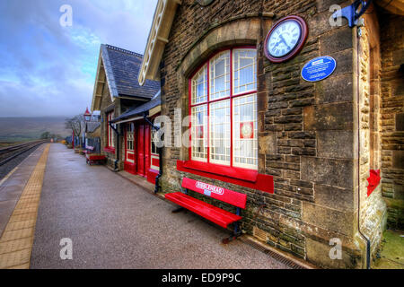 The railway station at Ribblehead which is on part of the famous Settle to Carlisle line. Ribbleshead is in the Yorkshire Dales  Stock Photo