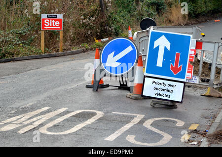 Roadsigns at a bridge under repair (Maidstone, England) Priority over oncoming vehicles Stock Photo