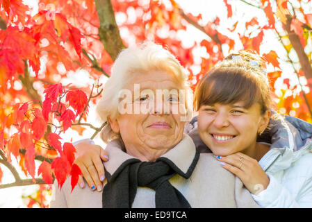 portrait of a happy family in autumn park Stock Photo