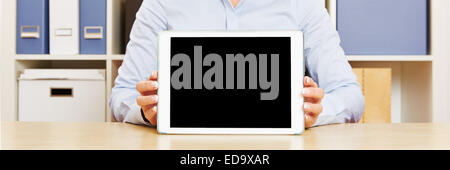 Panorama of hands holding a tablet computer on an office desk Stock Photo