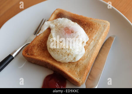 A poached egg on toast. Stock Photo