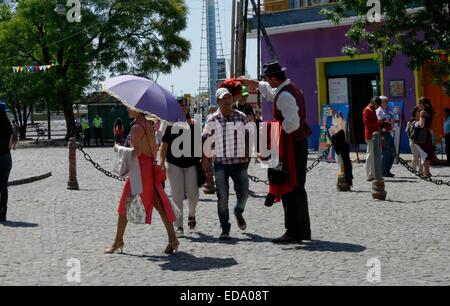 Tango dancers and tourists in the colourful area of Caminito, La Boca, Buenos Aires, Argentina Stock Photo