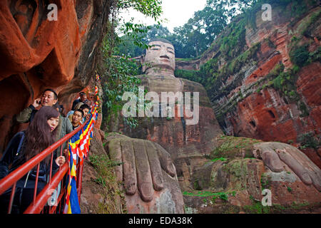 Queue of Chinese tourists walking down the stairs to see the Leshan Giant Buddha, stone-carved statue in Sichuan province, China Stock Photo