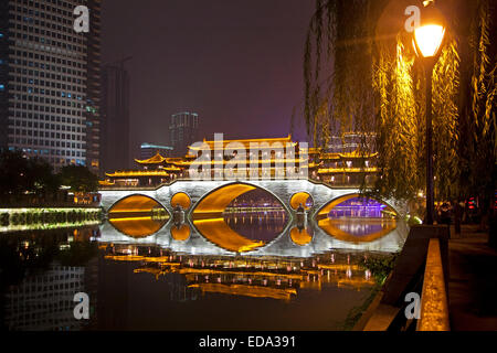 Illuminated Anshun Bridge over the the Jin River at night in the provincial capital of Chengdu in Sichuan, China Stock Photo