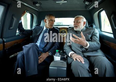 US President Barack Obama speaks with Indian Prime Minister Narendra Modi during a drive to visit the Martin Luther King, Jr. Memorial September 30, 2014 in Washington, DC. Stock Photo