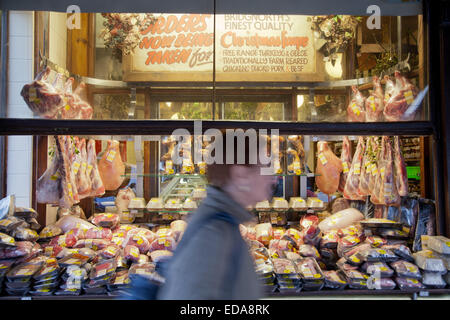 Traditional High Street butchers shop window with people in front, Bridgnorth, Shropshire UK Stock Photo