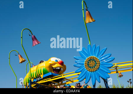Fair with kiddie roller coaster ride Stock Photo