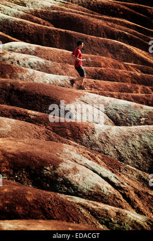 Man running in the badlands Stock Photo