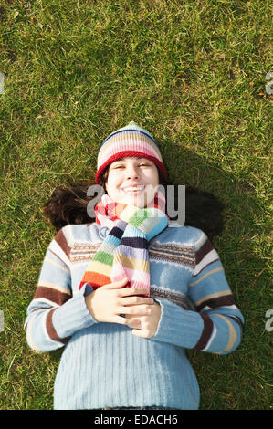 portrait of student lying on the ground Stock Photo