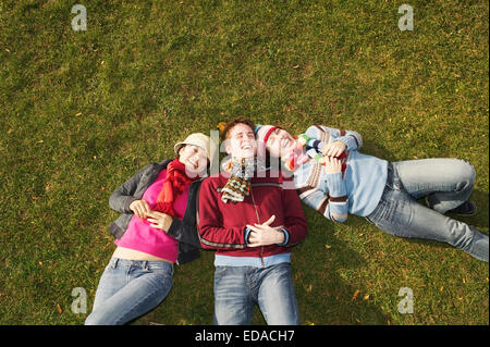group portrait of students lying on the ground Stock Photo