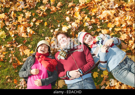group portrait of students lying on the ground Stock Photo