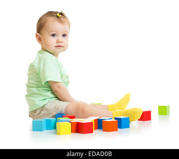 baby playing with colorful blocks isolated Stock Photo