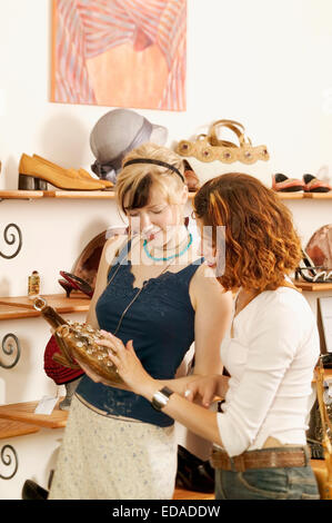 young women shopping for shoes Stock Photo