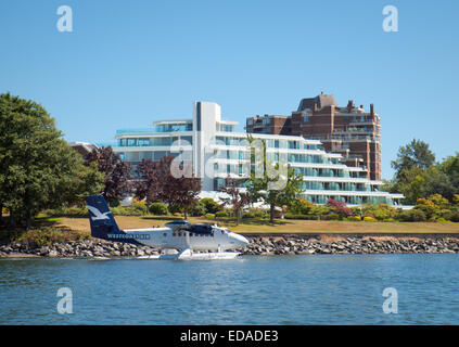 A Harbour Air DHC-6 DeHavilland Twin Otter seaplane in front of the Inn at Laurel Point in Victoria, British Columbia, Canada. Stock Photo