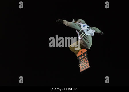 ISTANBUL, TURKEY - DECEMBER 20, 2014: Eric Willett jump in FIS Snowboard World Cup Big Air. This is first Big Air event for both Stock Photo