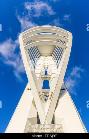 Modern architecture sightseeing on the south coast: Looking up at the iconic landmark Spinnaker Tower at Gunwharf Quays, Portsmouth with a blue sky Stock Photo
