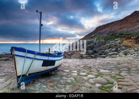 Fishing boat on the beach at Penberth Cove near Penzance in Cornwall Stock Photo