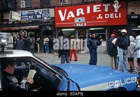 USA, HARLEM, NEW YORK CITY - APRIL 1978. 28th Precinct policeman in police patrol car in Harlem, New York City . Stock Photo