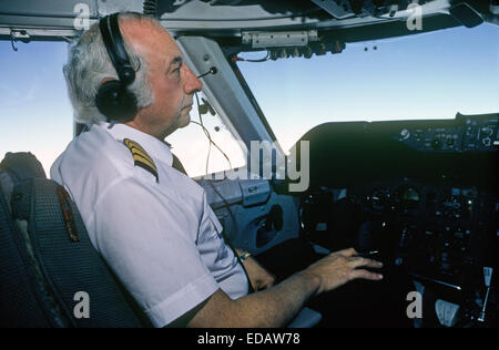 The captain of a Boeing 767 in the cockpit as the plane flies a route to South America from Miami, Florida Stock Photo