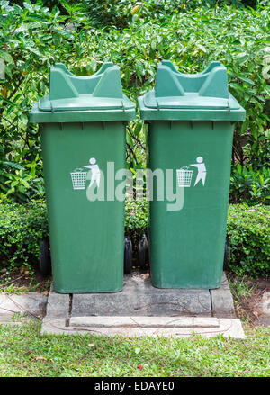 Twin green bin on the tropical garden in the park. Stock Photo