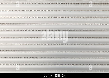 Close-up detail of closed metal security shutter Stock Photo
