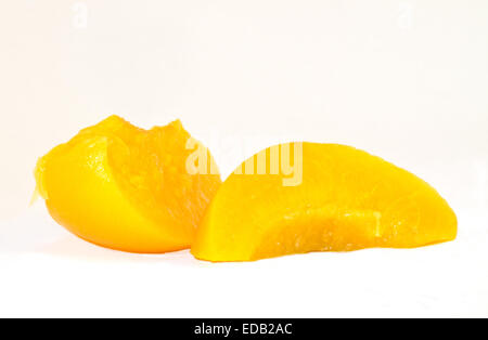 Two slices of peach on a plain white background Stock Photo