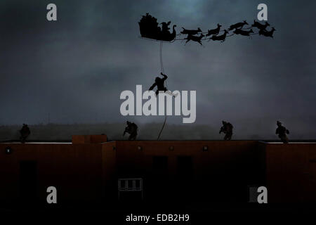 US Marines reconnaissance commandos repel down from Santa's sleigh during Christmas in a photo illustration December 24, 2014. Stock Photo