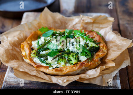 Filo pastry pie with roast green vegetable Stock Photo