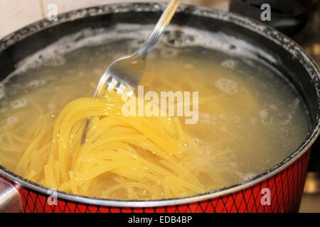 cooking pasta in the boiling water Stock Photo