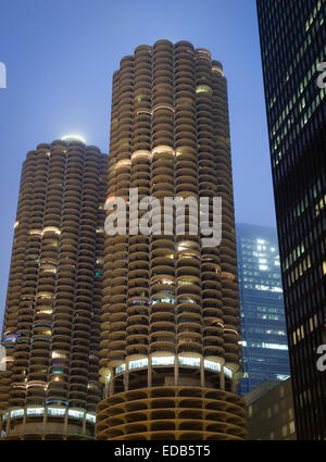 A night view of the corncob-shaped, Marina City twin towers and the IBM Building [AMA Plaza] (far right) in Chicago, Illinois. Stock Photo