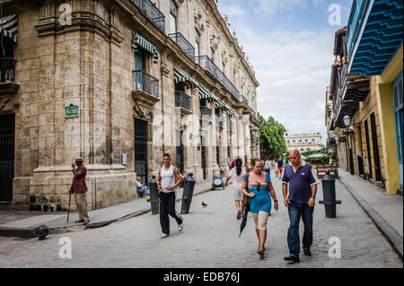 Street scene Old Havana, Cuba during trade embargo with USA. Buildings and people walking UNESCO World Heritage Site Stock Photo