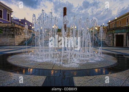 Low Angle View of a Fountain on Plaza del Quinto Centenario at Night, San Juan, Puerto Rico Stock Photo