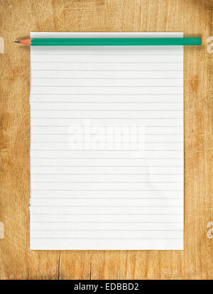 Writing Notes concept, graphite pencil and piece of blank paper as copy space on wooden table. Stock Photo