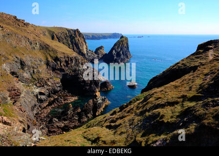 Rocks and coast Kynance Cove The Lizard  Cornwall England UK on a beautiful sunny summer day with blue sky and sea Stock Photo