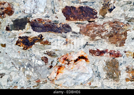 Closeup of an old and rustic stone wall suitable for background Stock Photo