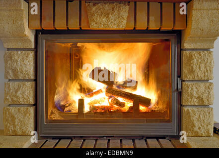 Roaring flames in a modern fireplace Stock Photo