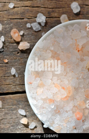 himalayan pink salt on old wood table Stock Photo