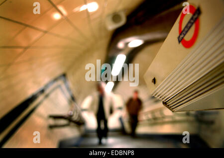 A CCTV camera watches passengers at on underground station walkway. Stock Photo