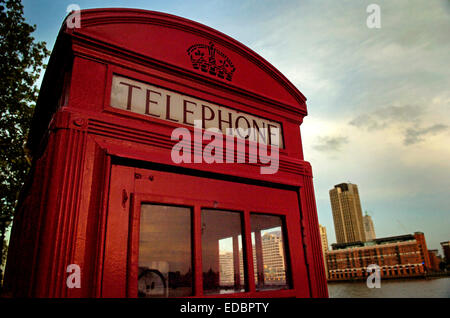 A classic telephone box by the Thames river Stock Photo