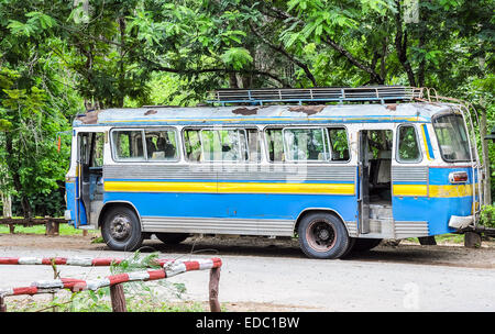 Old travel bus is park in the national park. Stock Photo