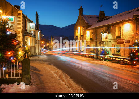 UK,Derbyshire,Peak District,Castleton,Christmas Lights with Mam Tor in Distance Stock Photo