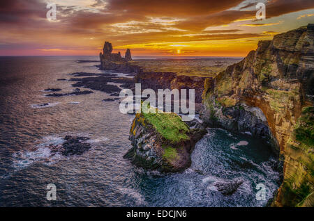 Londrangar sea stacks and the Thufubjarg cliffs. Iceland Stock Photo