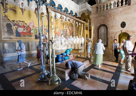 The stone of the Anointing at the Church of the Holy Sepulchre. Also known as 'The Stone of Unction Stock Photo