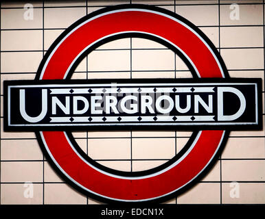 London, UK - November 21, 2014: Close up traditional underground sign, the sign was first used in 1908, now this logo used by ot Stock Photo