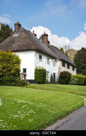 Thatched houses in the village of Milton Abbas, Dorset, England, UK Stock Photo